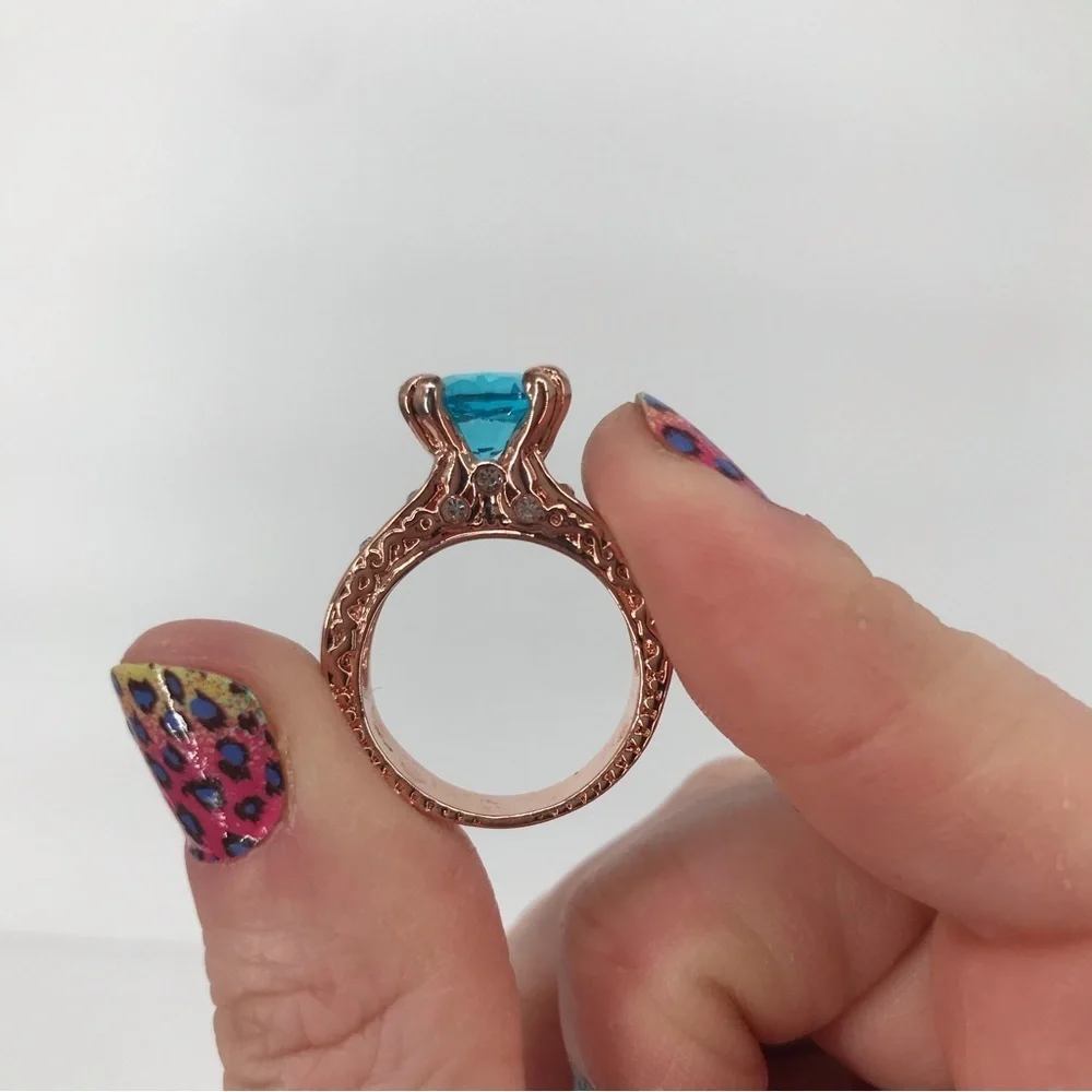 Mixed Metal Solitaire Ring with Blue Stone